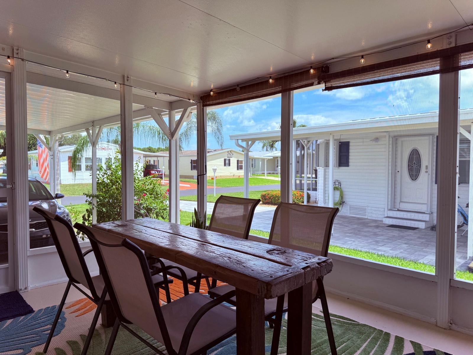 223 Sea Conch Place, Unit 14 Fort Pierce, FL 34982 - Photo 9 of 28 a view of a patio with a table and chairs