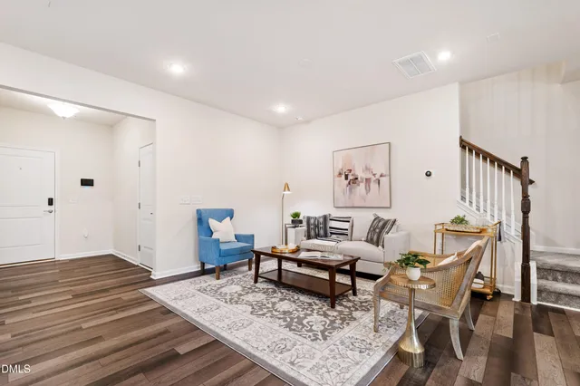 a couple of flower plants in front of door