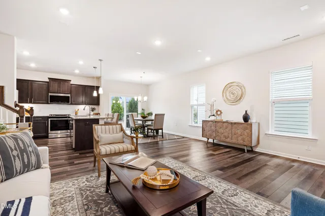 a living room with furniture and a rug