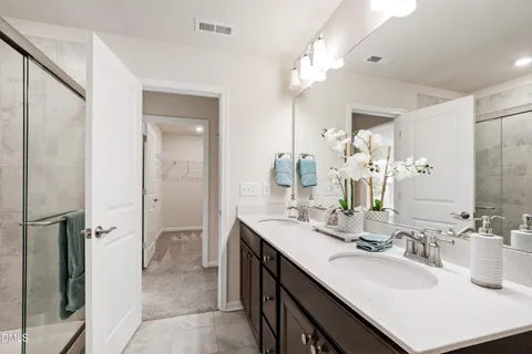 a kitchen with a sink cabinets and wooden floor