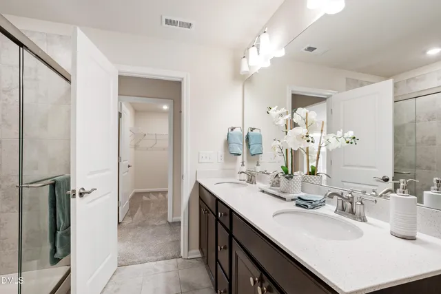 a kitchen with a sink cabinets and wooden floor