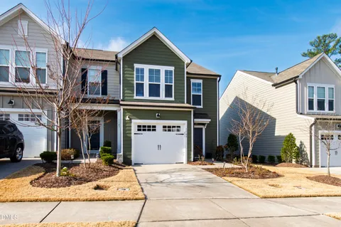a bathroom with a sink double vanity granite tub shower and a mirror