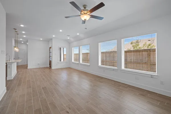 a front view of a house with a garden view