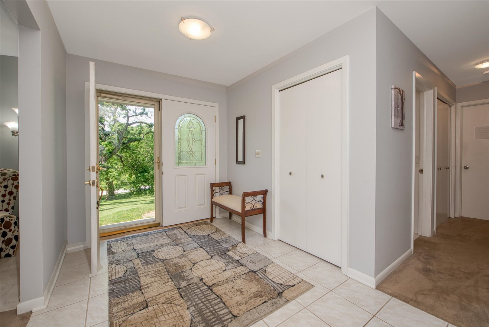 1196 Nottingham Lane Elgin, IL 60120 - Photo 8 of 45 a view of a hallway with windows and natural light