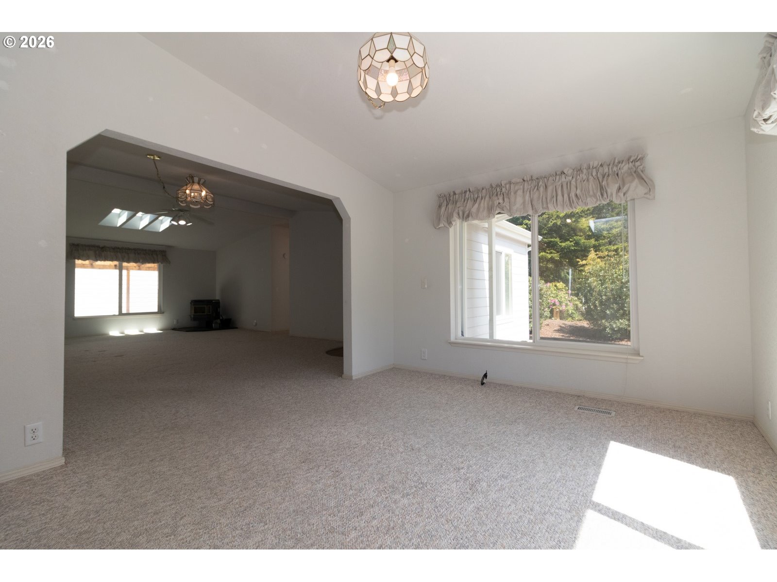499 Sherwood Loop Florence, OR 97439 - Photo 14 of 39 a view of an empty room with a window