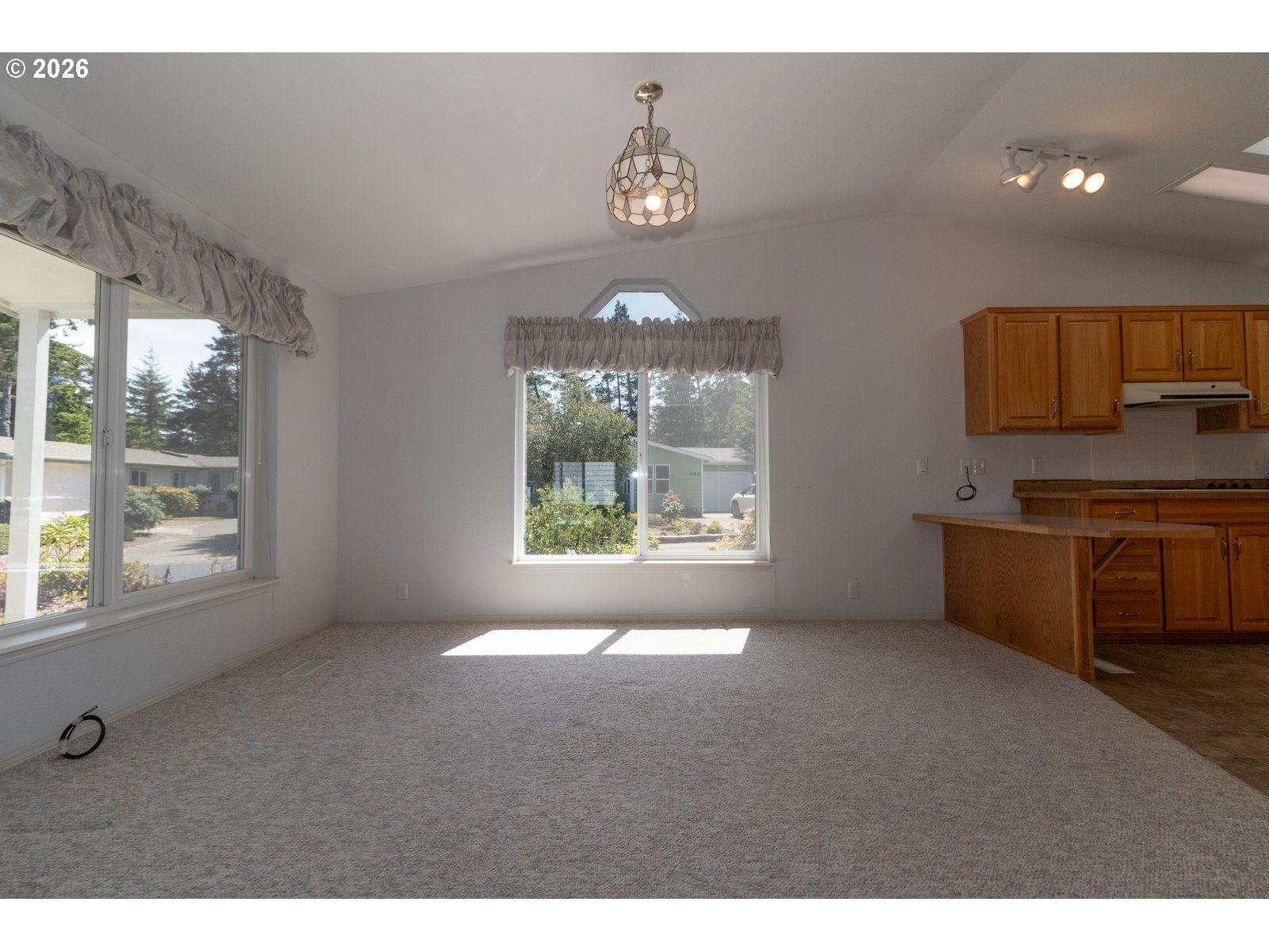 499 Sherwood Loop Florence, OR 97439 - Photo 15 of 39 a living room with furniture and a large window