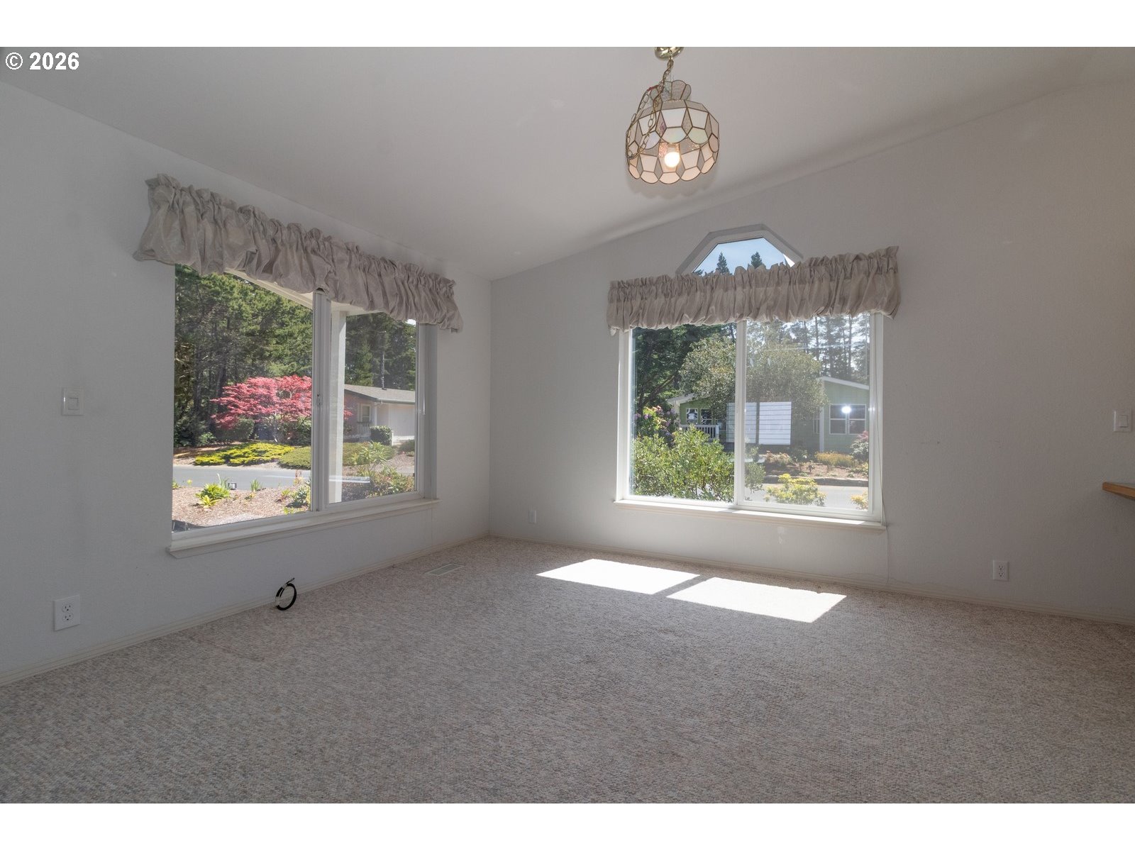 499 Sherwood Loop Florence, OR 97439 - Photo 16 of 39 a view of an empty room with a window