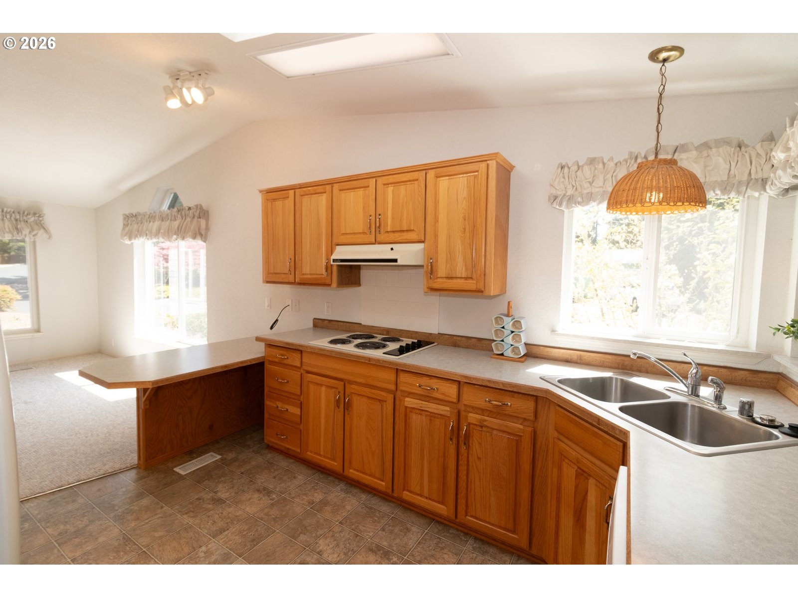 499 Sherwood Loop Florence, OR 97439 - Photo 21 of 39 a kitchen with granite countertop a sink a counter top space and stainless steel appliances