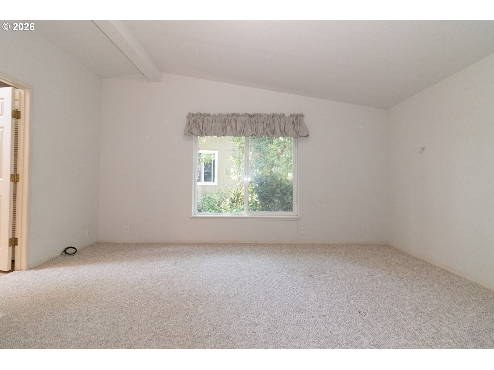 499 Sherwood Loop Florence, OR 97439 - Photo 25 of 39 a view of an empty room with a window