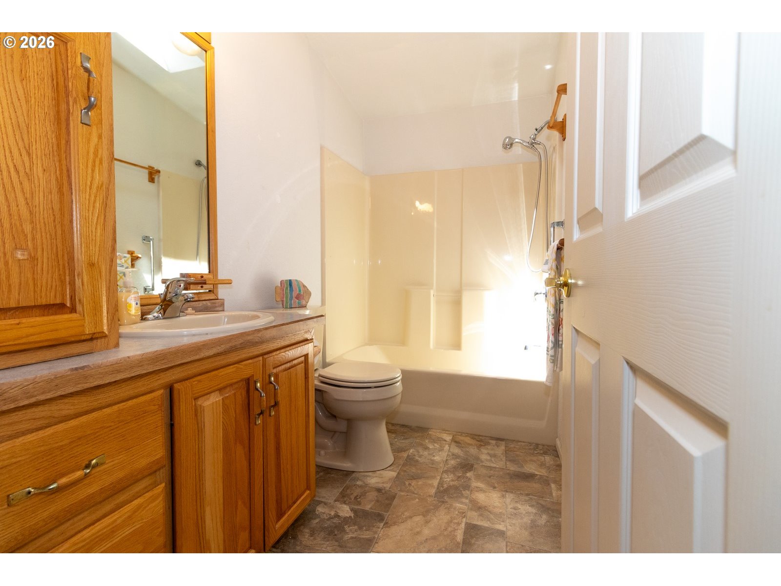 499 Sherwood Loop Florence, OR 97439 - Photo 33 of 39 a bathroom with a sink a toilet and a mirror