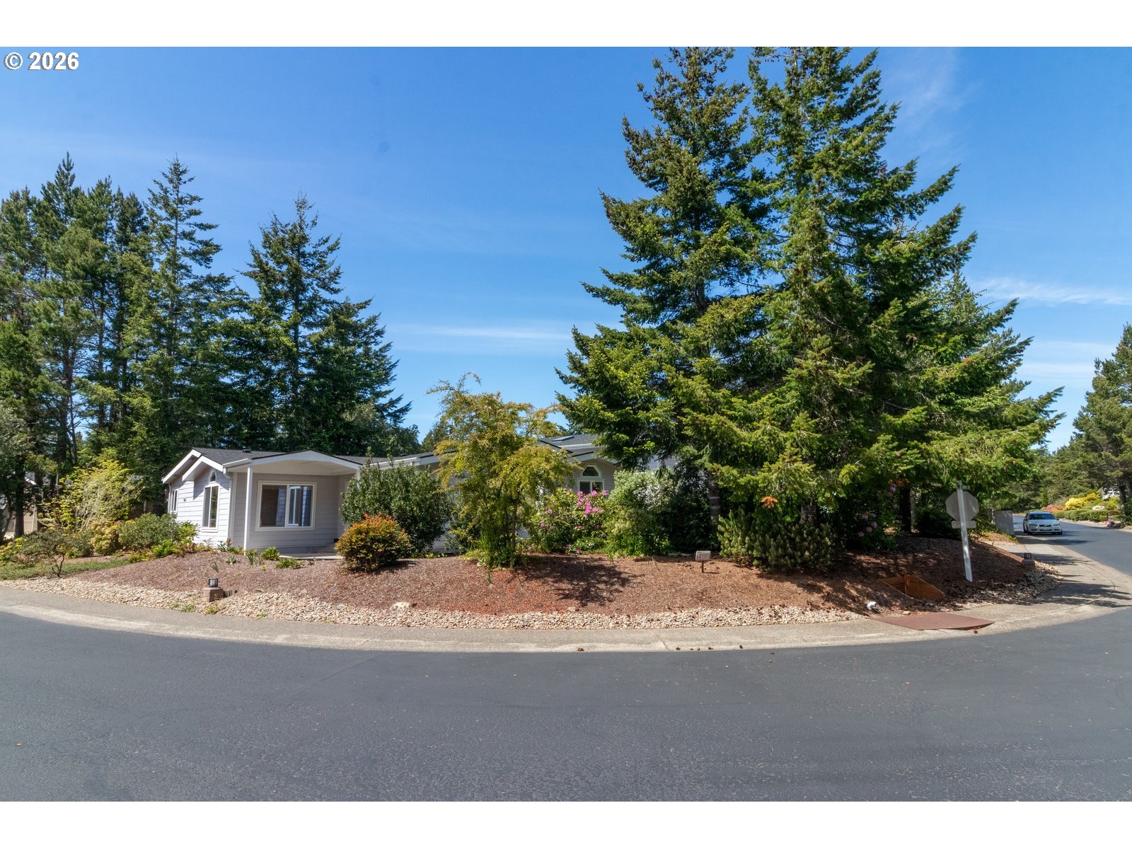 499 Sherwood Loop Florence, OR 97439 - Photo 4 of 39 a house view with a outdoor space