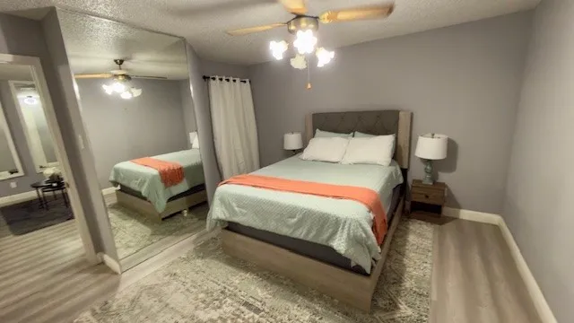 a large bed sitting in a bedroom next to a window