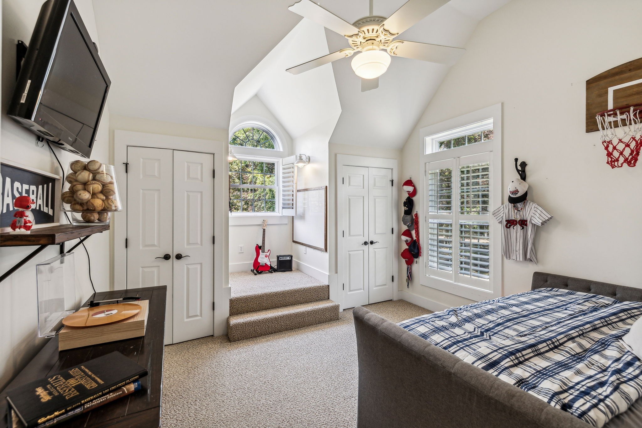 10795 Threet Road Christiana, TN 37037 - Photo 26 of 37 a bedroom that has a bed and a chandelier