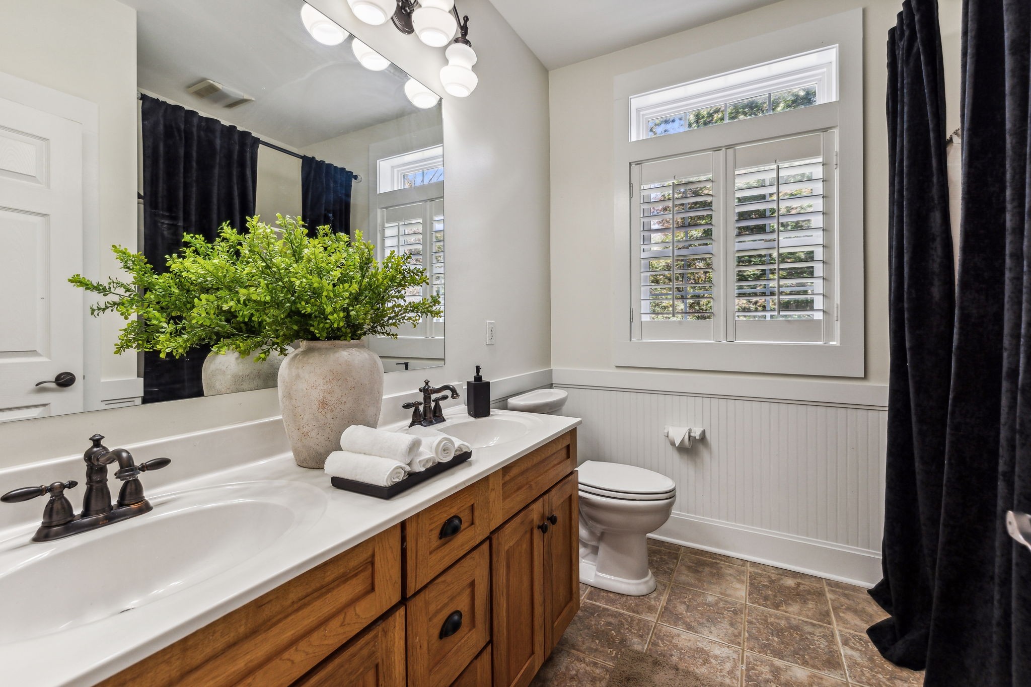 10795 Threet Road Christiana, TN 37037 - Photo 30 of 37 a bathroom with a sink a large mirror and a toilet