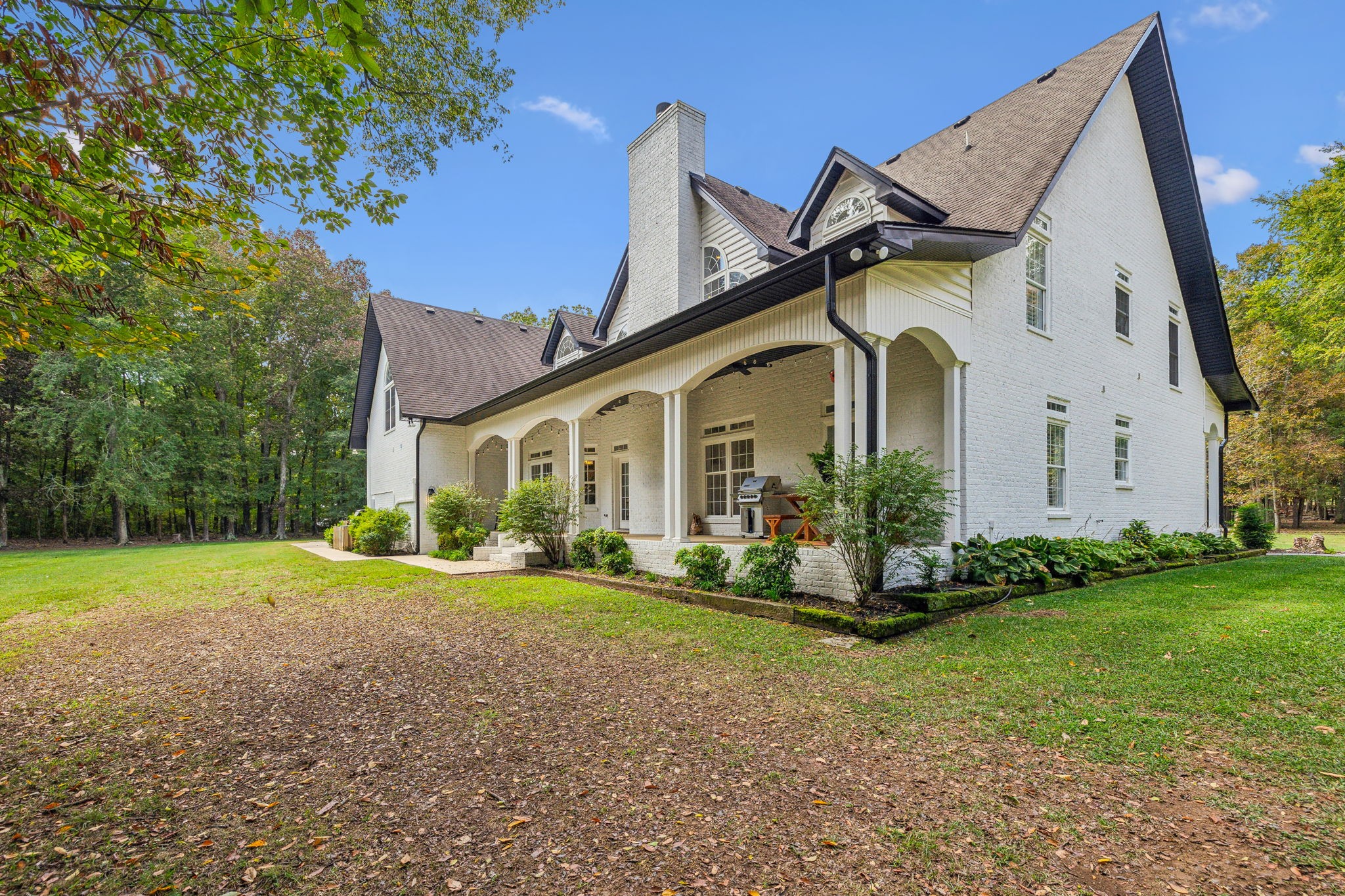 10795 Threet Road Christiana, TN 37037 - Photo 31 of 37 a front view of a house with garden