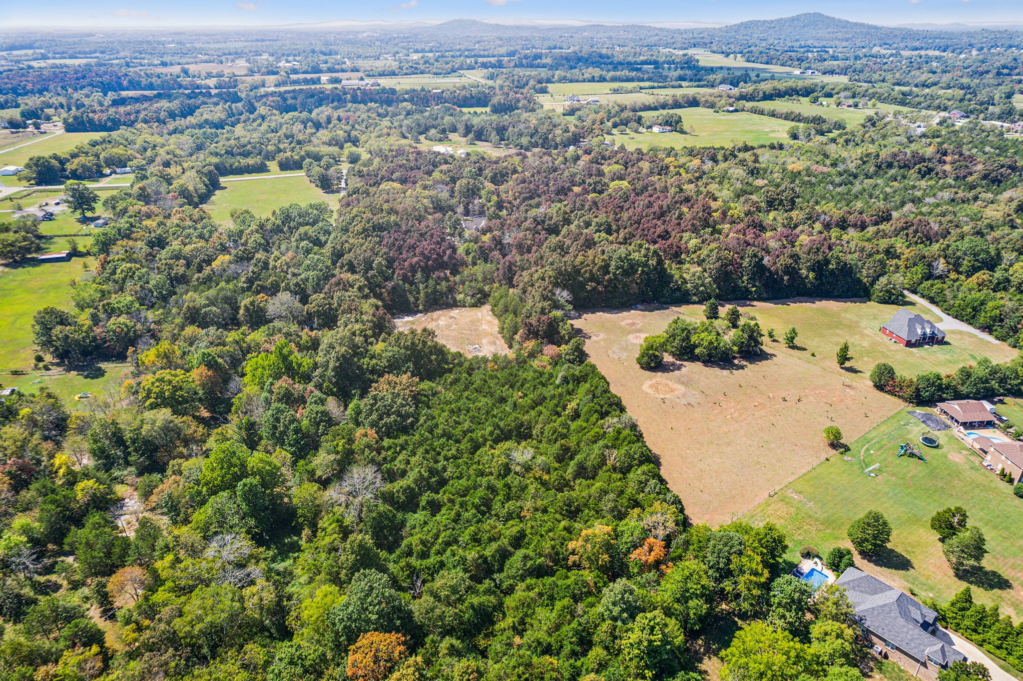10795 Threet Road Christiana, TN 37037 - Photo 36 of 37 an aerial view of a city with lots of residential buildings