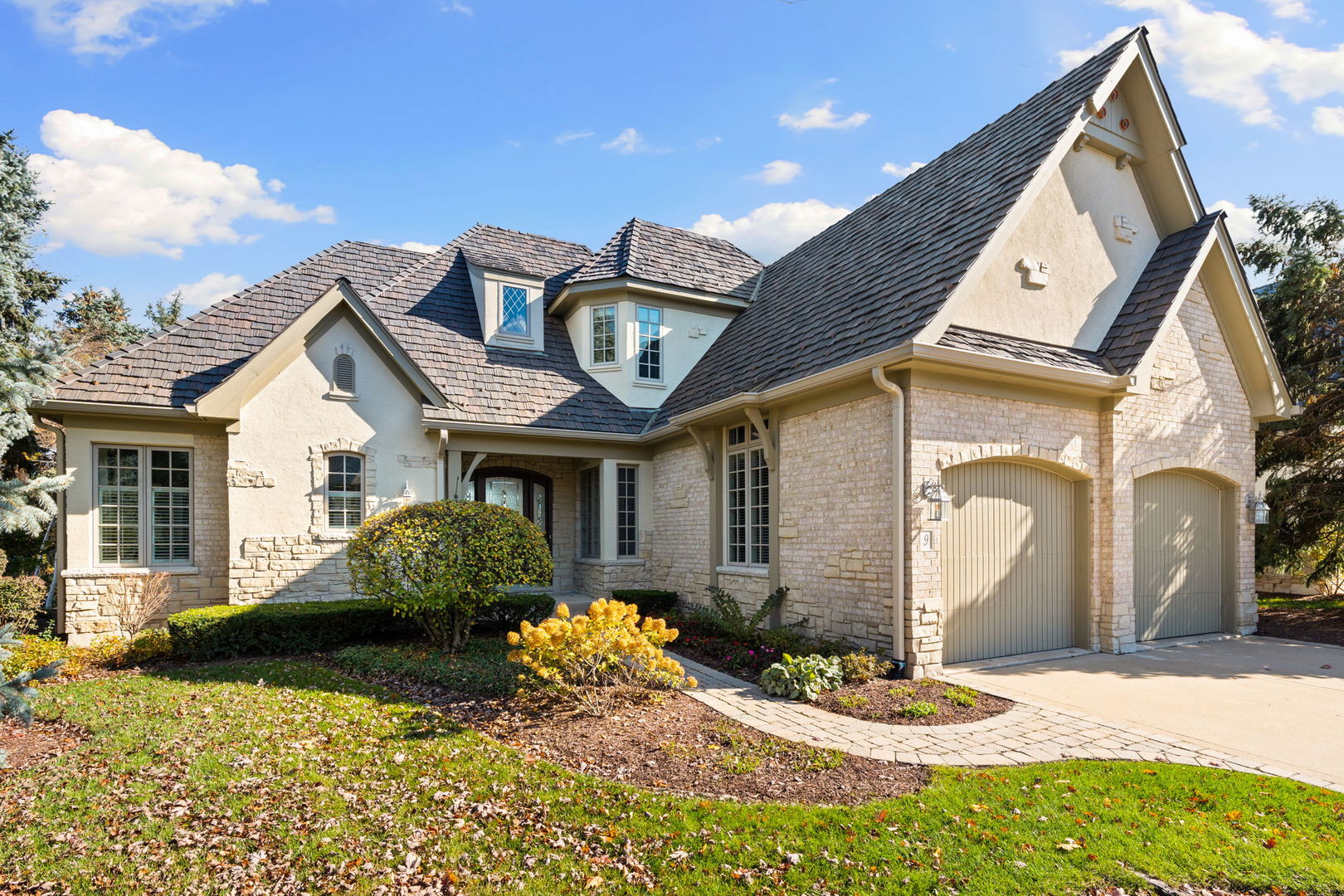 9 Forest Gate Circle Oak Brook, IL 60523 - Photo 1 of 39 a front view of a house with a yard