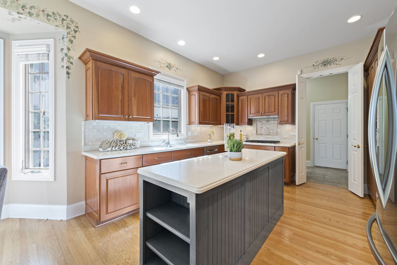9 Forest Gate Circle Oak Brook, IL 60523 - Photo 17 of 39 a kitchen with a sink stove and refrigerator