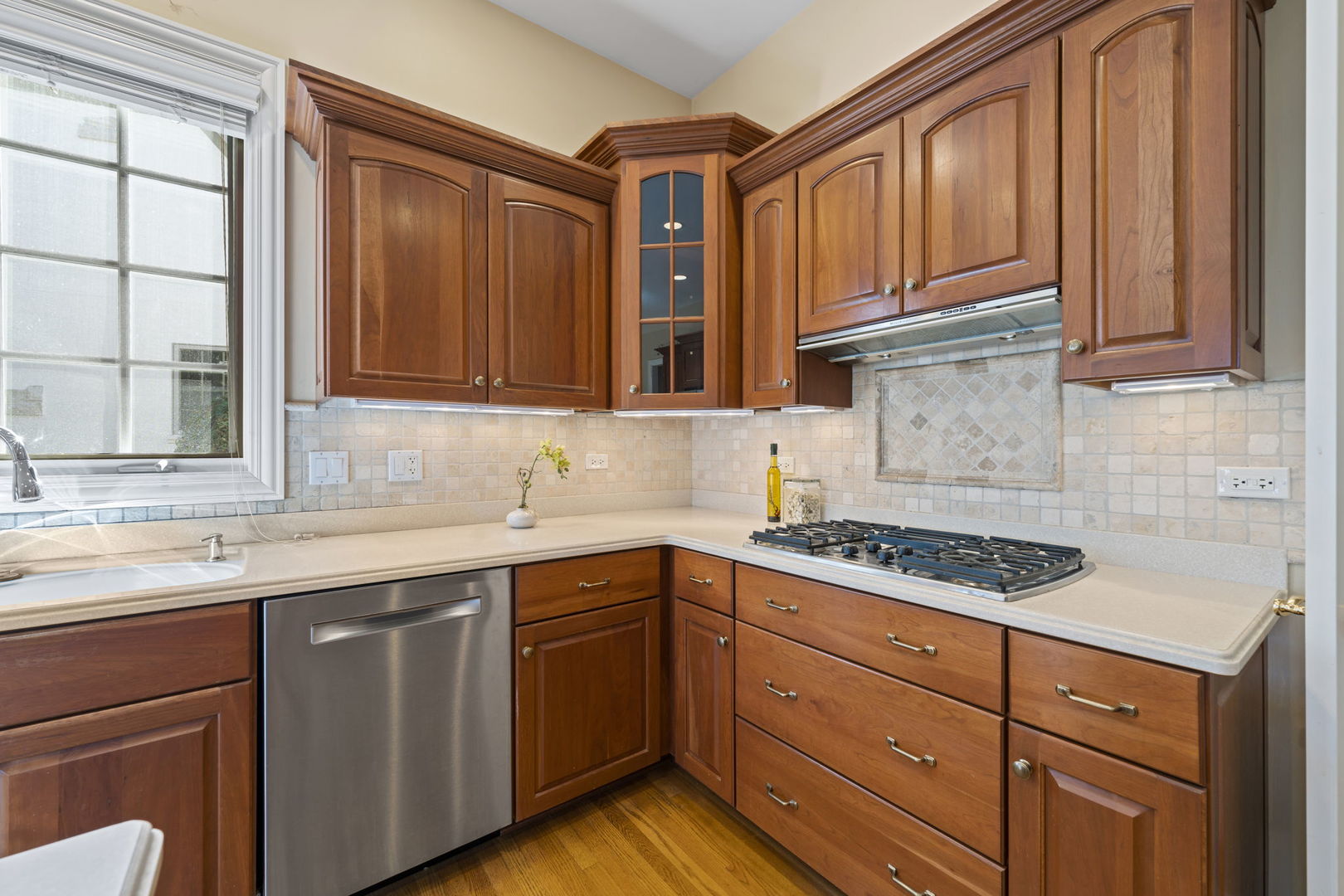9 Forest Gate Circle Oak Brook, IL 60523 - Photo 21 of 39 a kitchen with stainless steel appliances granite countertop a sink stove and cabinets