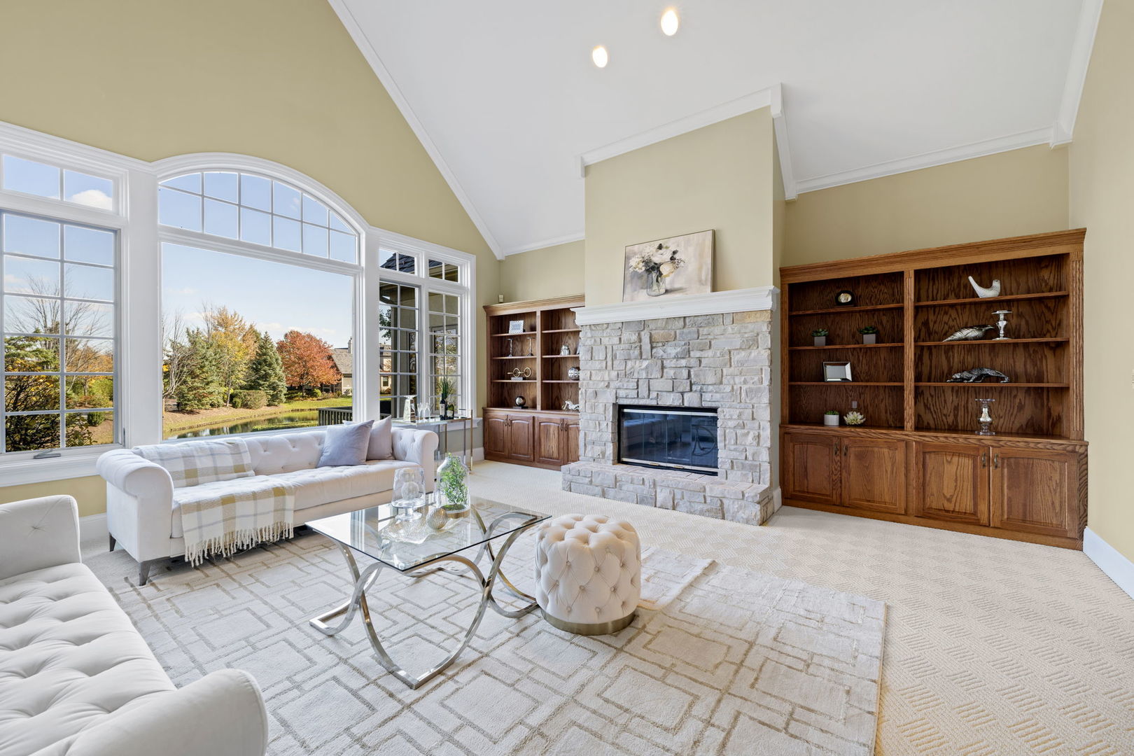 9 Forest Gate Circle Oak Brook, IL 60523 - Photo 5 of 39 a living room with furniture a fireplace and a large window