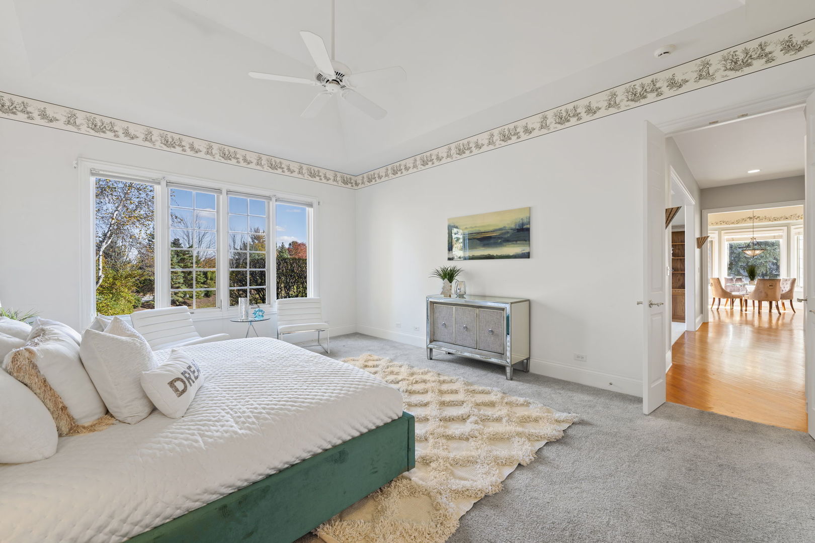 9 Forest Gate Circle Oak Brook, IL 60523 - Photo 8 of 39 a large bedroom with a bed and wooden floor