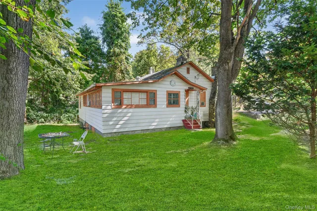 a picture of a park with a white wall