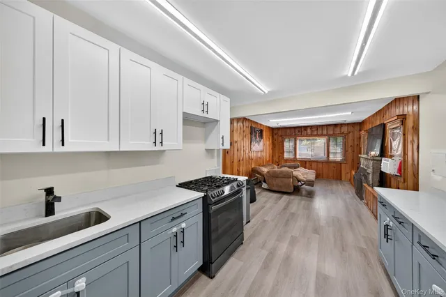 a kitchen with a sink and wooden cabinets
