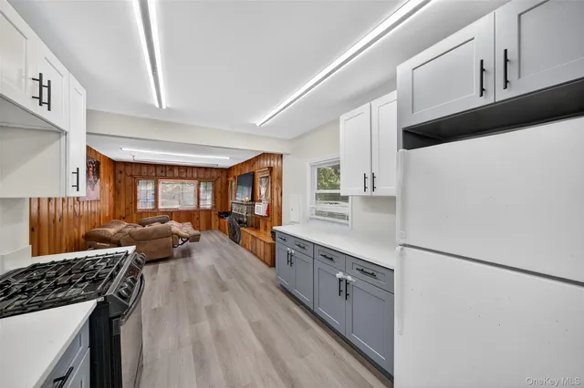 a kitchen with stainless steel appliances a stove and a refrigerator