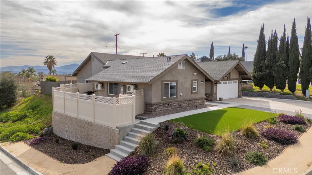 7840 Standish Avenue Riverside, CA 92509 - Photo 1 of 1 a front view of a house with swimming pool having outdoor seating