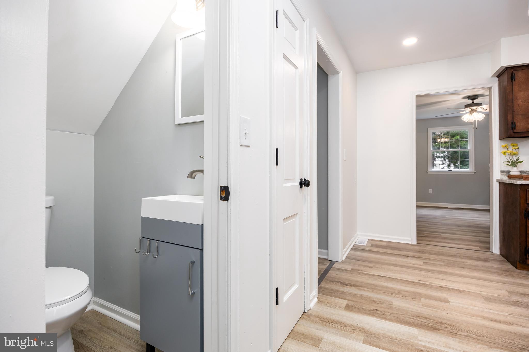 31939 Downing Road Delmar, MD 21875 - Photo 11 of 45 a bathroom with a sink toilet and shower