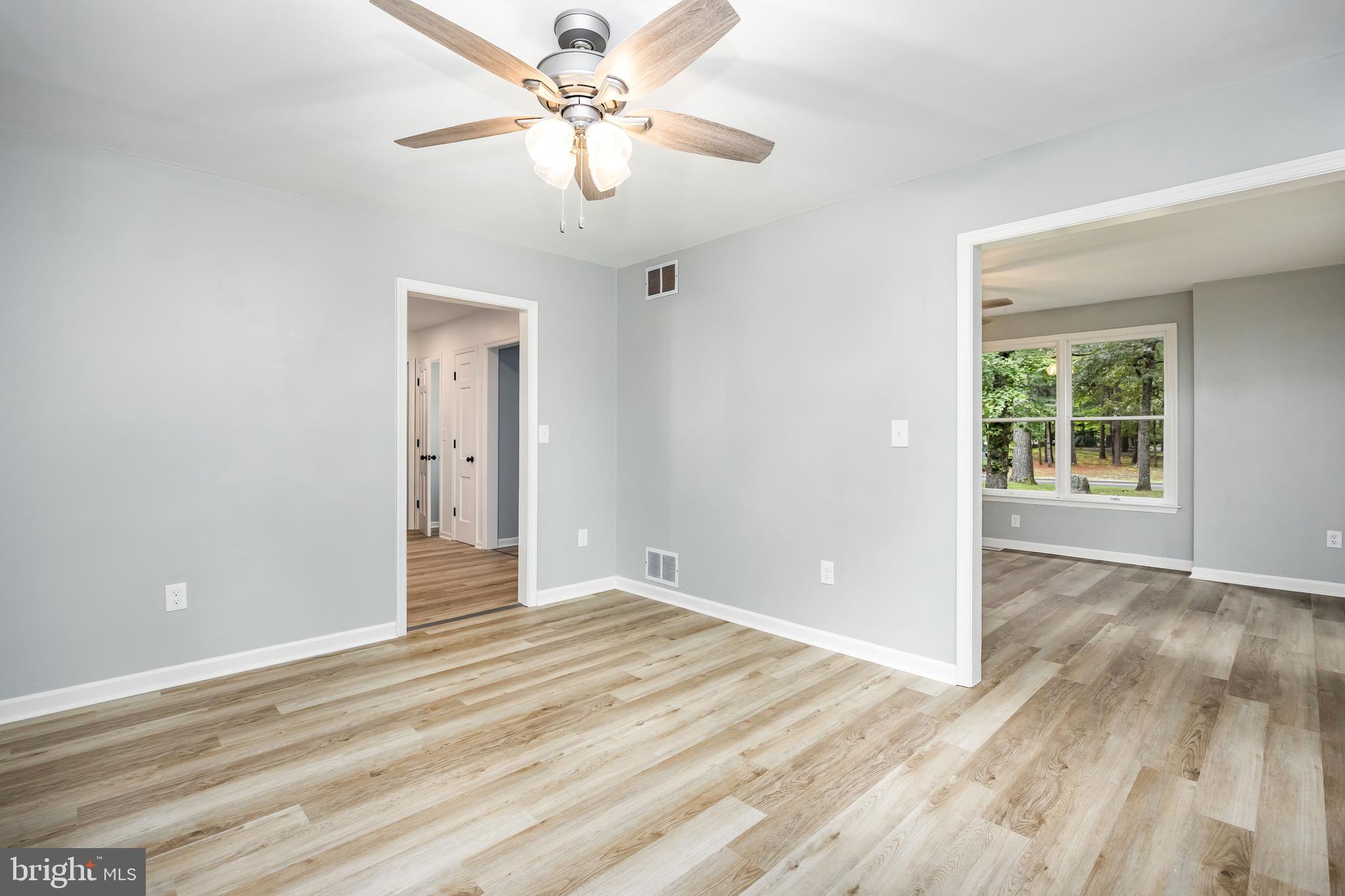 31939 Downing Road Delmar, MD 21875 - Photo 15 of 45 a view of an empty room with wooden floor and a window