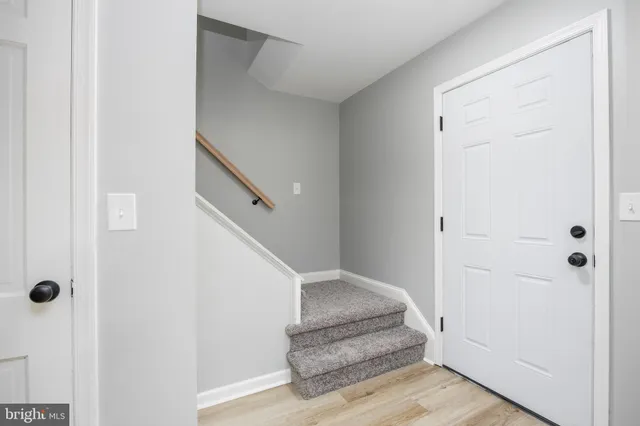a view of a hallway with staircase