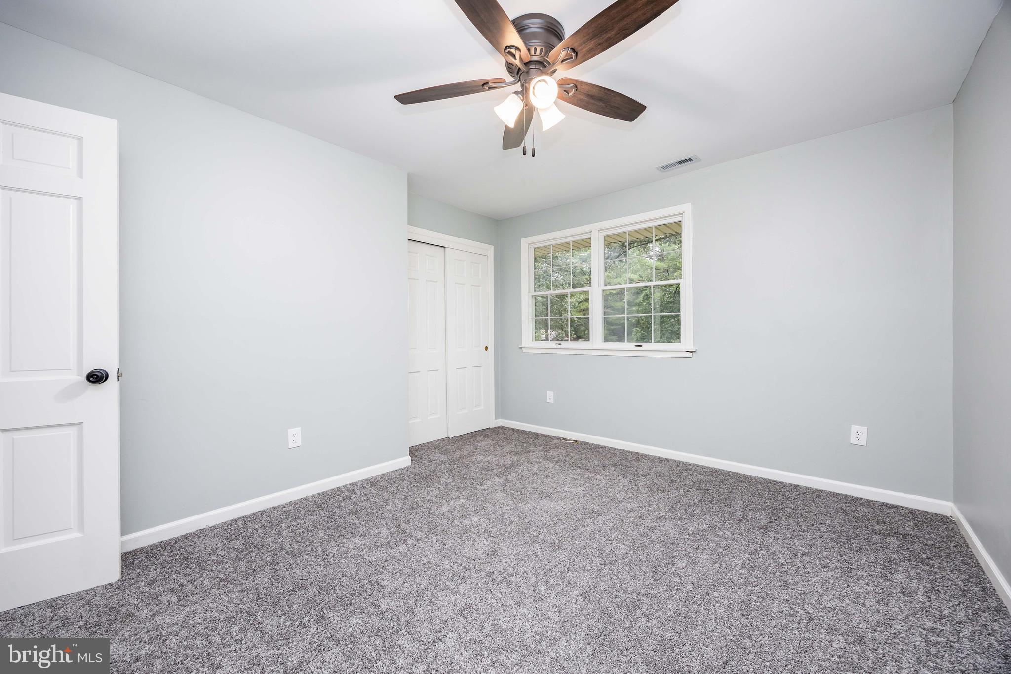31939 Downing Road Delmar, MD 21875 - Photo 24 of 45 an empty room with windows and fan