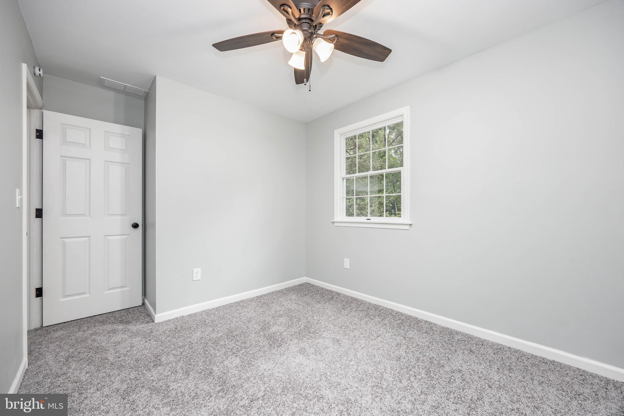 31939 Downing Road Delmar, MD 21875 - Photo 28 of 45 an empty room with windows and fan
