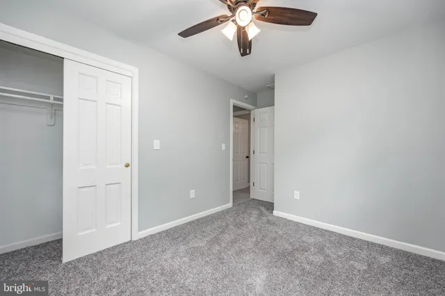 an empty room with closet area