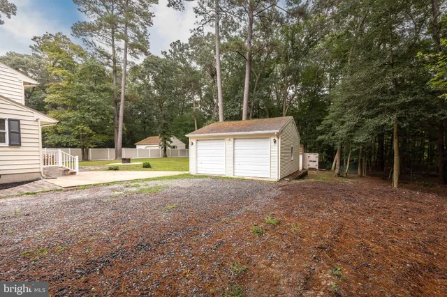 a view of a house with a yard and garage