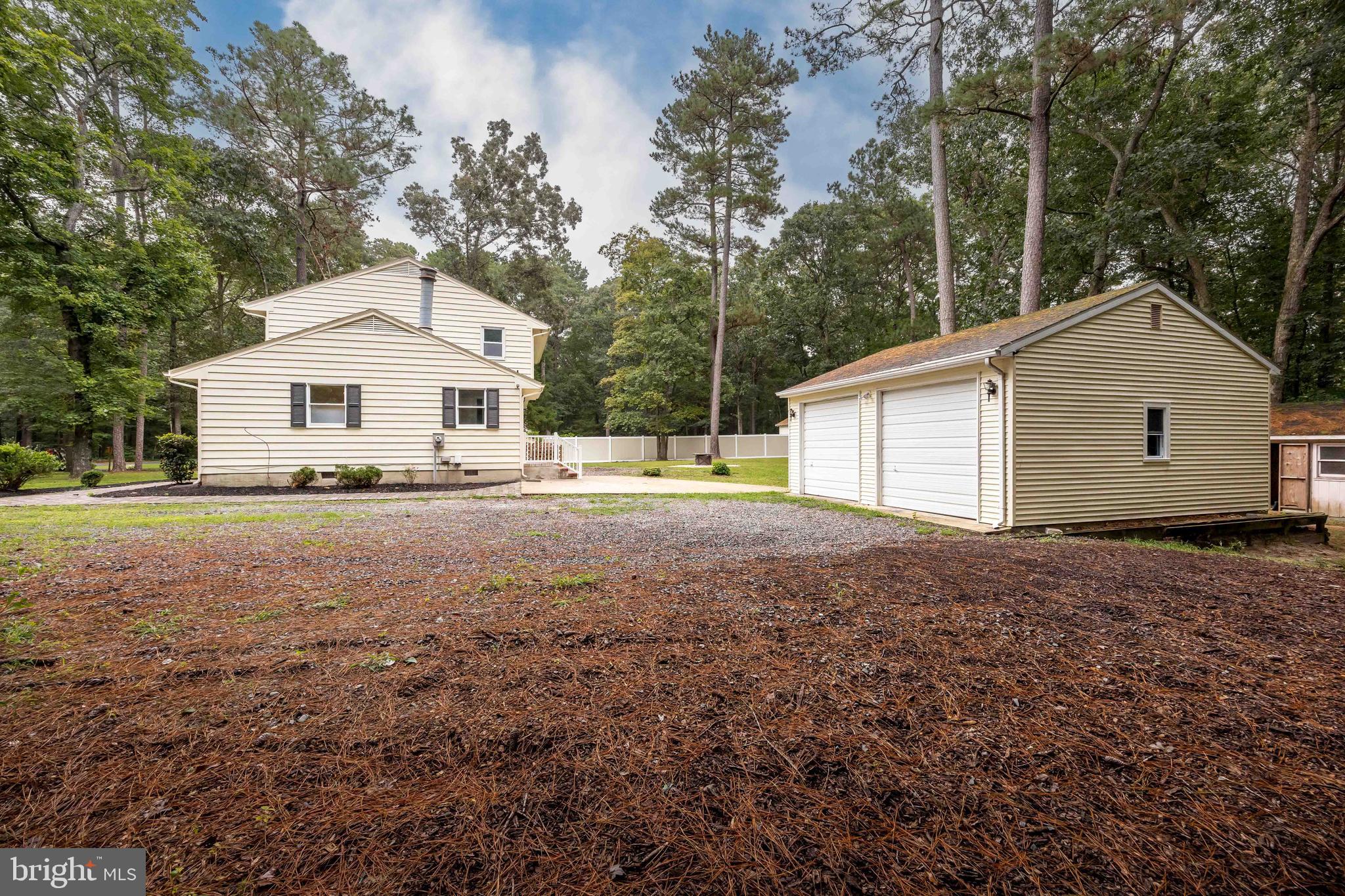 31939 Downing Road Delmar, MD 21875 - Photo 43 of 45 a front view of a house with a yard and trees