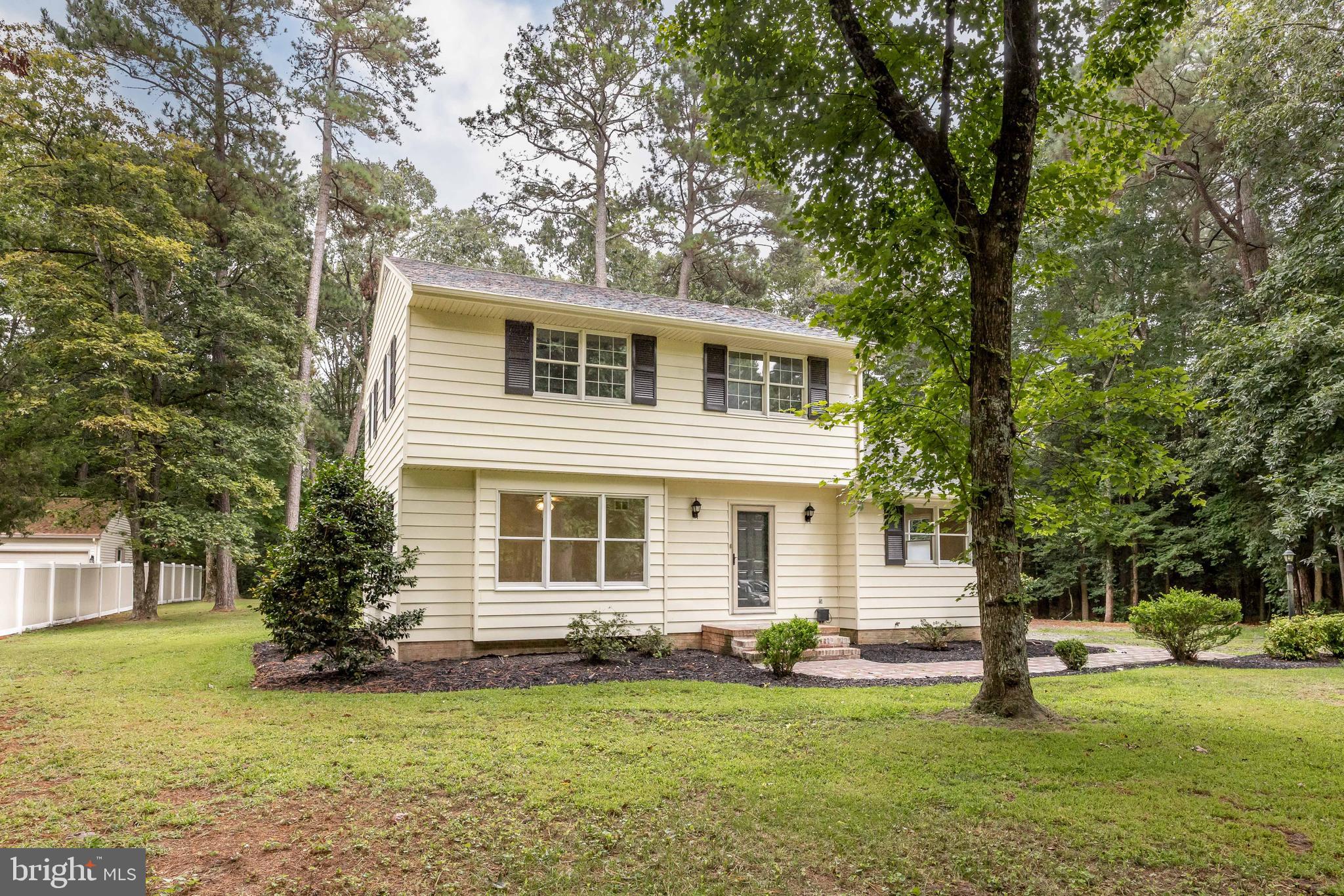 31939 Downing Road Delmar, MD 21875 - Photo 45 of 45 a front view of a house with a garden
