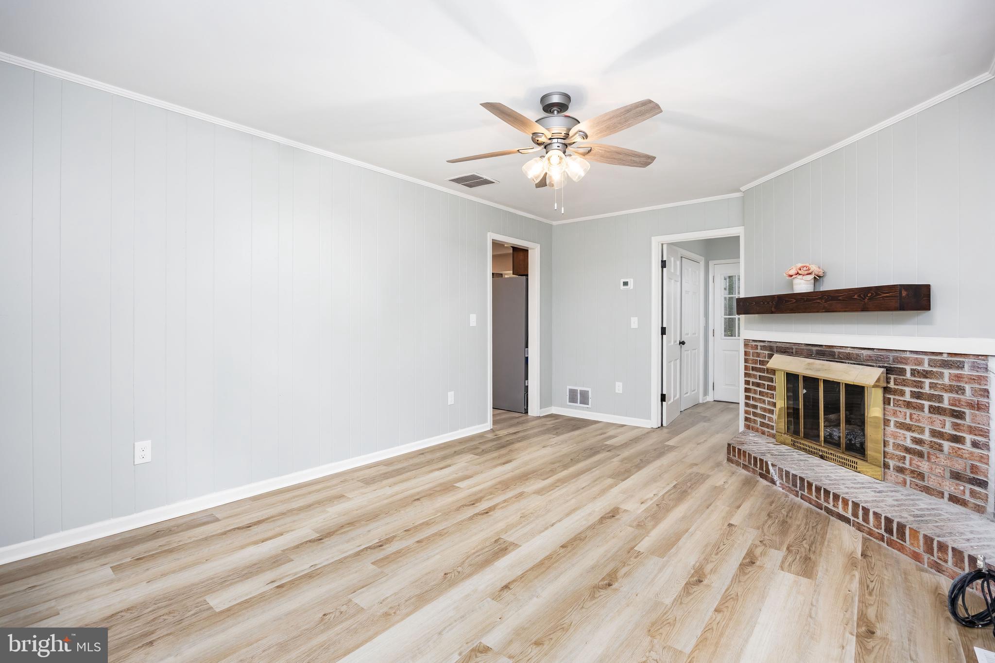 31939 Downing Road Delmar, MD 21875 - Photo 10 of 45 a view of empty room with fireplace