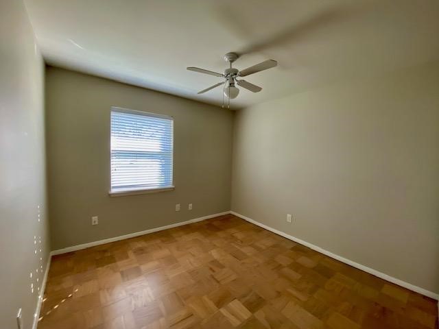 6002 Effingham Drive Houston, TX 77035 - Photo 14 of 22 an empty room with a window and ceiling fan