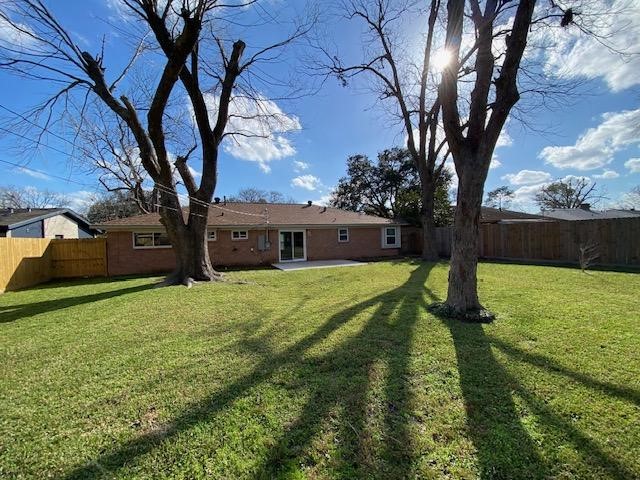 6002 Effingham Drive Houston, TX 77035 - Photo 22 of 22 a front view of a house with garden