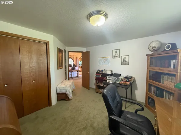 a bedroom with furniture and a window