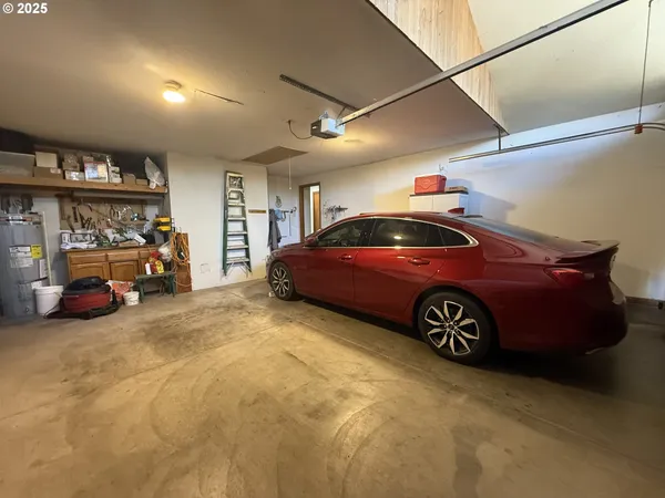 a view of parking garage with cars parked