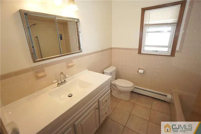 a view of a bathroom with a sink and a mirror
