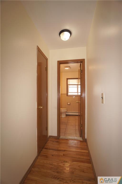 400 Washington Avenue Linden, NJ 07036 - Photo 15 of 18 a view of a bathroom with a sink and a mirror