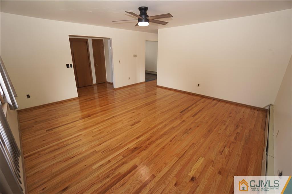 400 Washington Avenue Linden, NJ 07036 - Photo 5 of 18 wooden floor in an empty room