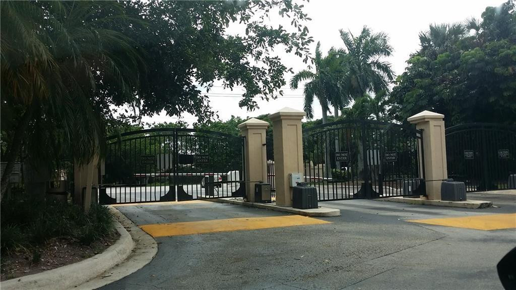 4221 West McNab Road, Unit 29 Pompano Beach, FL 33069 - Photo 15 of 15 a swimming pool with outdoor seating and yard