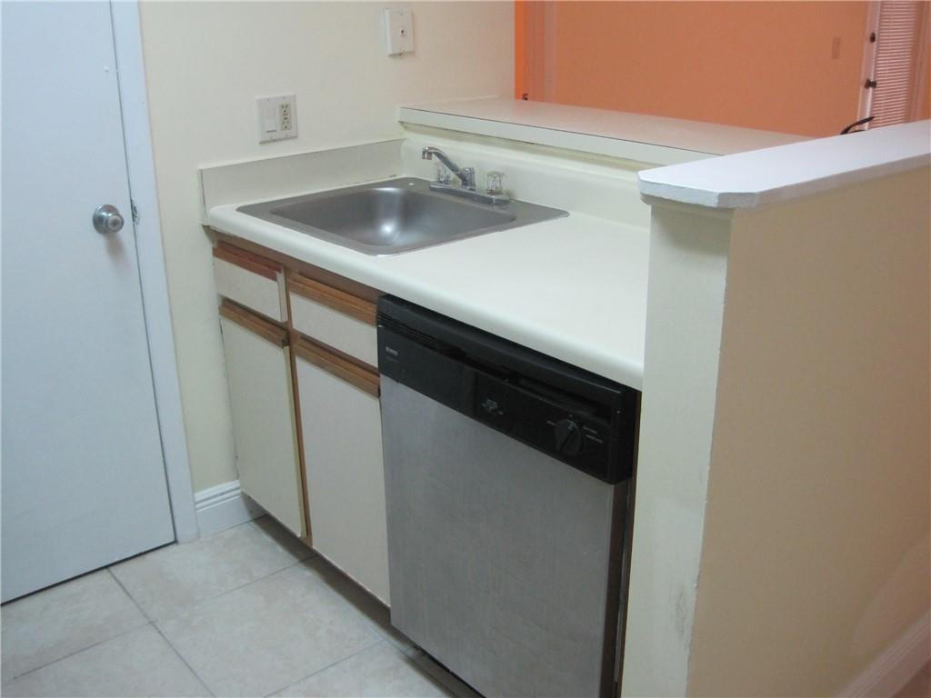 4221 West McNab Road, Unit 29 Pompano Beach, FL 33069 - Photo 4 of 15 a close view of sink and microwave