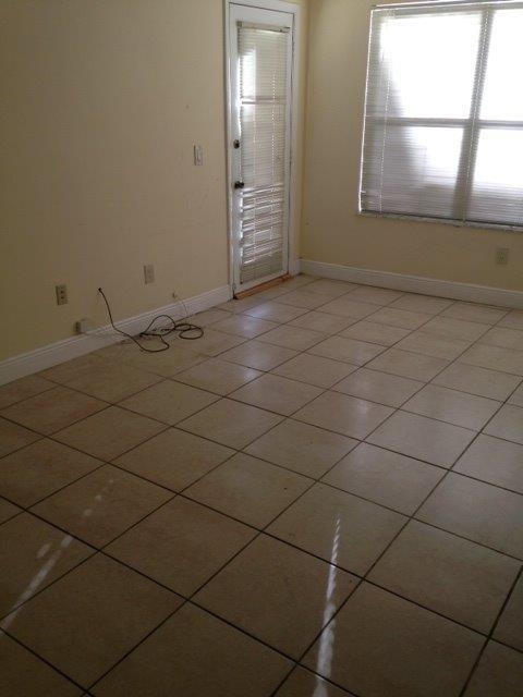 4221 West McNab Road, Unit 29 Pompano Beach, FL 33069 - Photo 7 of 15 a view of an empty room and window