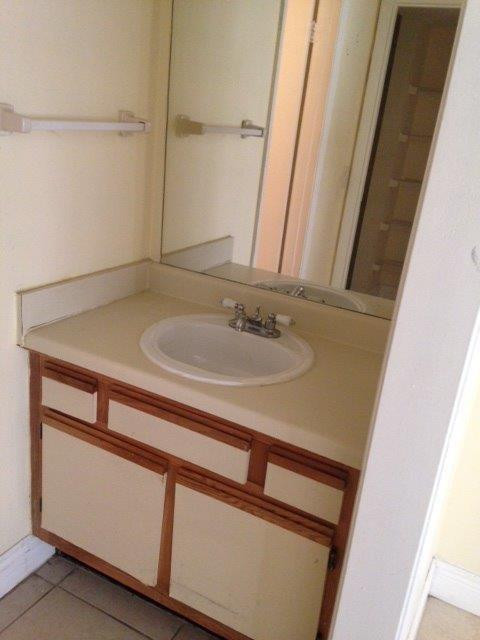 4221 West McNab Road, Unit 29 Pompano Beach, FL 33069 - Photo 10 of 15 a bathroom with a sink and a mirror